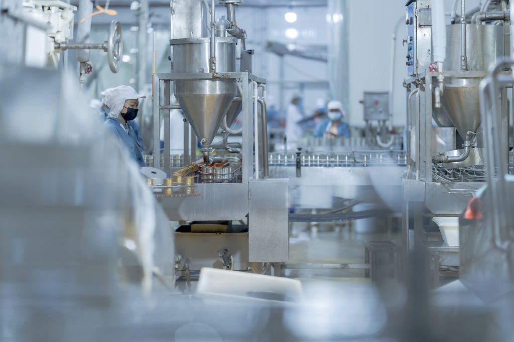 industrial food production line with a worker ensu utc